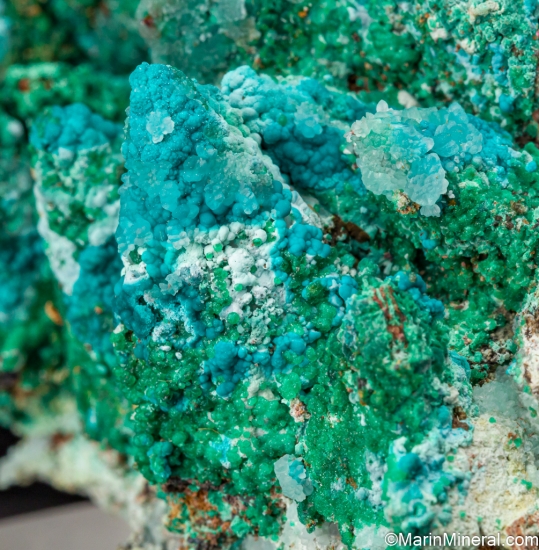 Cuprian Adamite, Rosasite, Smithsonite, Malachite on Calcite casts from Christiana Mine, Laurion, Attica, Greece [db_pics/pics/ST936e.jpg]