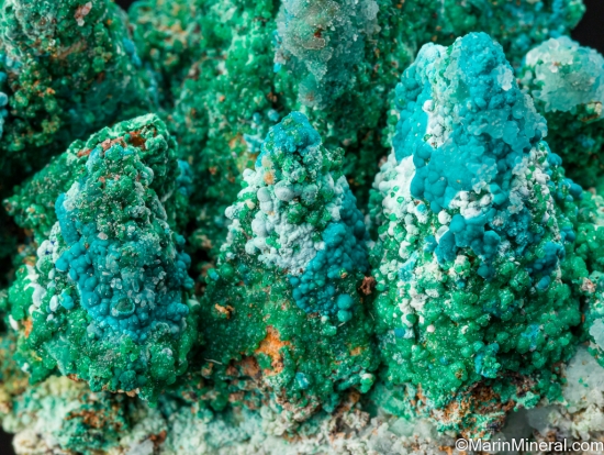 Cuprian Adamite, Rosasite, Smithsonite, Malachite on Calcite casts from Christiana Mine, Laurion, Attica, Greece [db_pics/pics/ST936f.jpg]