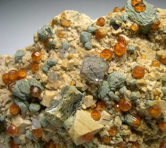 Fluorite, Spessartine, Mica on Orthoclase from Tongbei, Fujian Prov., China [db_pics/pics/a659c.jpg]